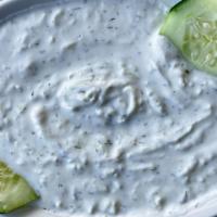 Tzatziki · A traditional Greek dip, combines yogurt with grated cucumbers, fresh garlic and dill weed.