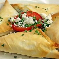 Spanakopita · Triangles of flaky filo filled with a tasty blend of spinach, onion, feta cheese, onion, egg...