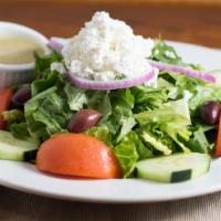 Greek · Crisp lettuce, tomatoes, cucumbers, red onion, feta cheese and kalamata olives. Served with ...
