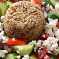 Horiatiki · A traditional villager salad of Mediterranean cucumbers, tomatoes, sweet peppers, feta chees...