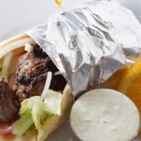 Beef Souvlaki · Marinated chunks of beef sirloin char-broiled and wrapped in pita bread with lettuce, tomato...