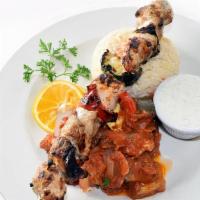 Chicken Kebab · Marinated chunks of chicken breast char-broiled with onion, red bell pepper, mushroom and zu...