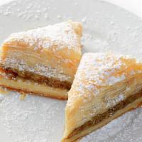 Baklava · A blend of walnuts, cinnamon and cloves, between layers of filo pastry. Topped with our ligh...