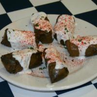 Dolmathes* · Rice, garbanzo beans, and spices are rolled into grape leaves; imparting a unique flavor and...