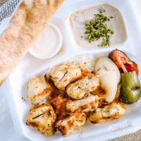 Chicken Kabob · Two skewers of saffron marinated and seasoned chicken breasts with a skewer of grilled veget...