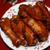 Sticky Chicken Wings · Comes with egg roll and pork rice.