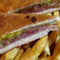 Cuban Sandwich · Slow roasted pork, ham, pickles, melted swiss cheese, mustard, and mayonnaise on a fresh rol...