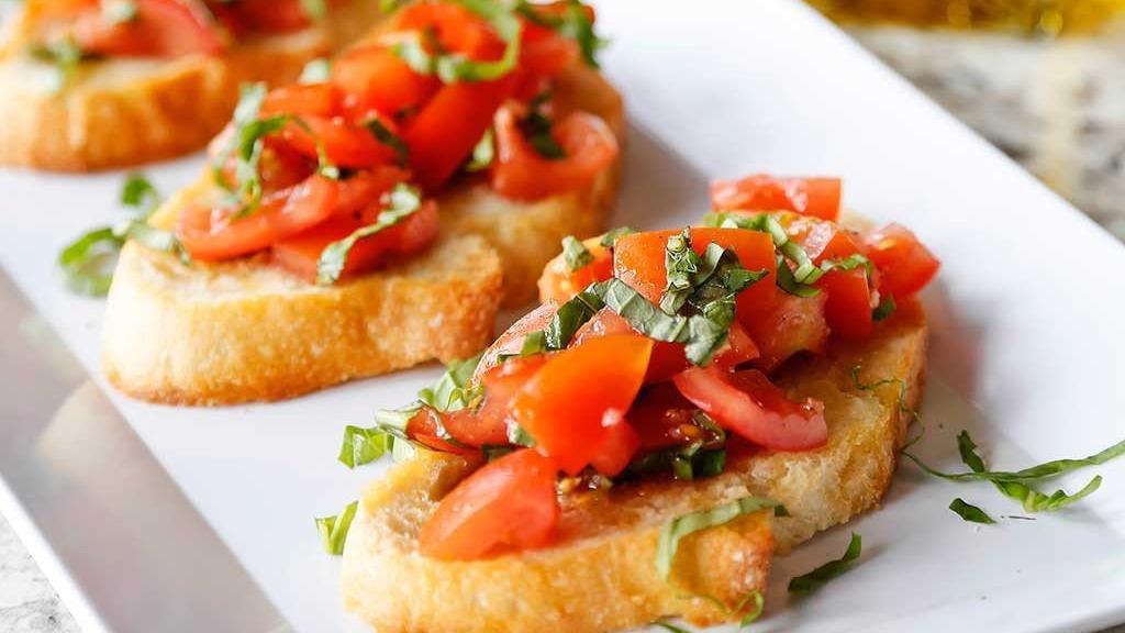 Bruschetta · Toasted bread topped with chopped tomato, fresh basil, extra virgin olive, and garlic.