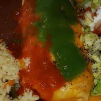 Burrito (Res O Pollo) · Your choice of beef or chicken burrito served with rice refried beans and salad.
