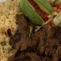 Bistec Tipico · Grilled beef and chicken served with two pan-fried eggs rice refried beans and salad.