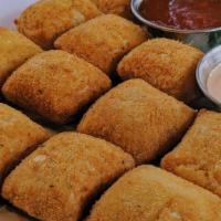 Cheese Croquettes (Salgadinhos De Queijo) · Savory dough shaped into a square and filled with cheese and oregano. Battered and then frie...