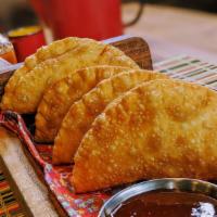 Heart Of Palm Empanada (Pastel De Palmito) (2Pcs) · This delicious and creamy vegan empanada is made with light pastry dough and filled with hea...