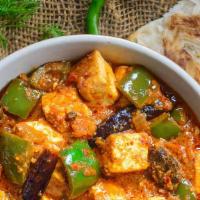 Karahi Paneer · Paneer cooked with onions, bell peppers and tomatoes.