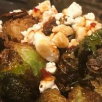 Brussel Sprouts · Fried brussels, hot honey, crumbled goat cheese, and fresno pepper jelly.