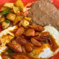 Pancho Villa Specialty · Two eggs your choice, topped with country sausage guisado, served with refried bean and papa...