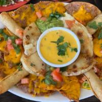 The Fiesta · A little bit of everything - small corn quesadilla, flautas, nachos, guacamole, queso and so...