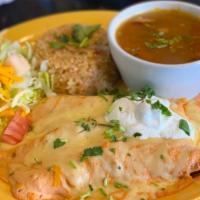 Jalapeño Cream Cheese Chicken Enchiladas · Three enchiladas stuffed with shredded chicken, topped with Monterey jack cheese and sour cr...