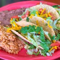 Crispy Taco Plate · Three-piece tacos filled with your choice of picadillo or pollo guisado, topped with lettuce...