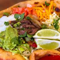 Olga'S Special Taco Salad · Taco salad bowl filled with lettuce, tomatoes, bell peppers and onions, topped with your cho...