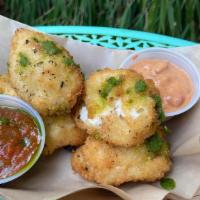 Crispy Parmesan Shells · Pasta in a rich Alfredo sauce and mozzarella cheese coated in seasoned panko and deep fried ...