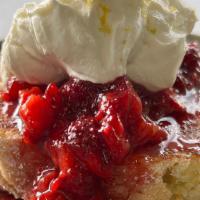 Olive Oil Cake And Berries · Sugar seared olive oil cake topped with local strawberries, mascarpone crème, and lemon zest
