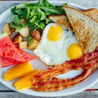 Eggs Your Way · Two farm-fresh eggs, bacon or turkey sausage, potatoes, fruit, toast.