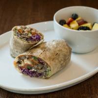 Southwestern Wrap · Grilled fajita steak, sautéed peppers, and onions, red cabbage, hominy, pico, cotija, avocad...