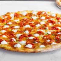 White Pepperoni Calabrian · Olive Oil and Garlic base, Mozzarella, Pepperoni, Calabrian Chili, Ricotta, and Romano.