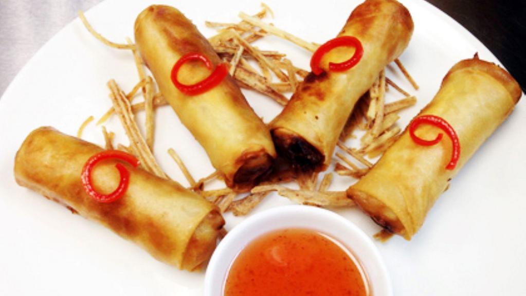 Crispy Spring Roll · Cabbage, carrot, taro root, glass noodles. Served with plum sauce.