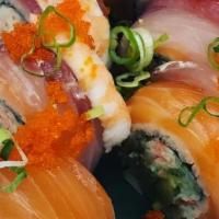 Rainbow Roll · Crab, avocado, cucumber roll topped with tuna, salmon, shrimp, masago, Scallion.