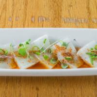 Hama Chili App · Thinly sliced yellowtail with spicy ponzu, diced chilis and chili powder.