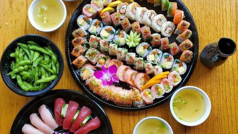 Sushi Deluxe Platter · Serves 4-5 people
A selection of our Signature Rolls
Koi Roll, Ocean Roll, Futomaki Roll, Hamachilli Roll, Tiger Eye, Tokyo Roll, Sunshine Roll, Red Devil Roll, Crazy Roll

4 pcs each of nigiri sushi, Tuna, Yellowtail, Salmon, Ebi
Large Edamame soybeans
4 Miso soups