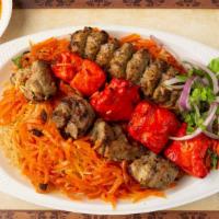 Super Jumbo Kabob · Combination of quabili Palau served with meat sauce and one kabob skewer of shami, chicken a...
