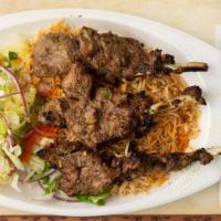 Chopan Kabob · Pieces of tender lamb chops marinated and broiled on a skewer over charcoal.