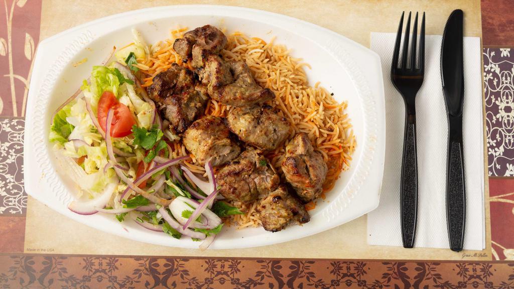 Lamb Kabob · Large pieces of tender lamb, marinated in special spices and garlic skewered and broiled over charcoal.