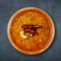Regal Yellow Lentils · Yellow Lentil garnished with tinch of garlic, dry red chilli and cumin seeds