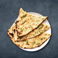 Og Garlic Naan · Fresh dough filled with garlic spread flat and baked in a indian clay oven.