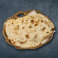 Simple Naan · Fresh dough spread flat and baked in a indian clay oven.