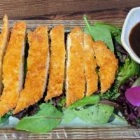 Chicken Katsu Appetizer · Sliced and cut fried breaded chicken on top of spring mix with tonkostsu sauce.