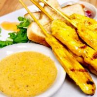 Chicken Satay · Charcoal-grilled chicken skewers (4 pieces), served with house-made peanut sauce