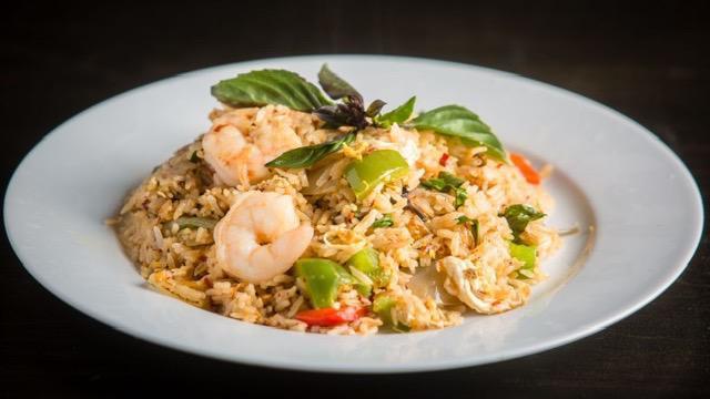 Spicy Fried Rice
 · Thai jasmine rice stir-fried with minced chili-garlic, egg, onion, red bell peppers and Thai basil.