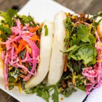 Bao Bun (1) · Steamed bun with choice of protein, kaleslaw, pickled cabbage & fried garlic