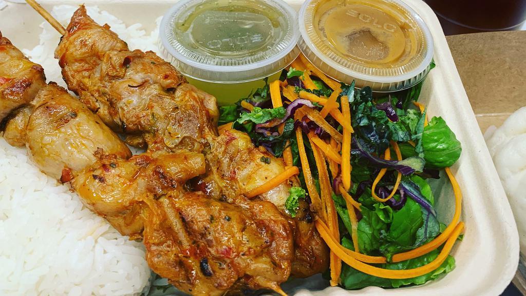 Chicken Rice Bowl · Grilled lemongrass marinated chicken skewers served with rice and salad
