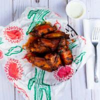 Grilled Wings · Served with your choice of sauce: Mind Melter, Legend, Bangin BBQ, Blackened (dry rub), HumD...