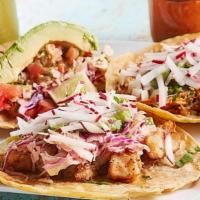 Fish Taco · Served with onion, cilantro, radishes, avocado salsa and  lime. Baja fish fried or grilled, ...