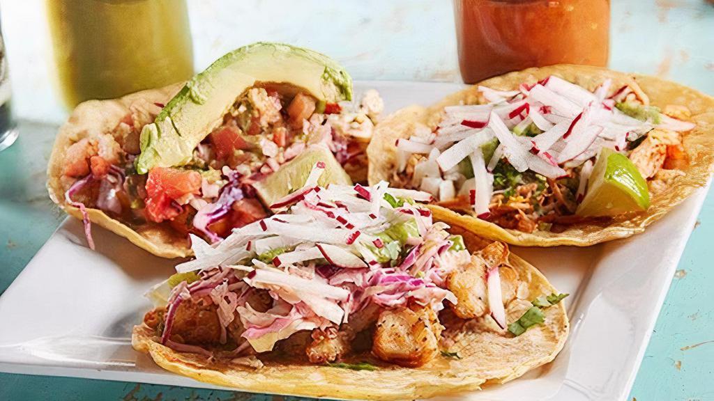 Fish Taco · Served with onion, cilantro, radishes, avocado salsa and  lime. Baja fish fried or grilled, slaw, avocado salsa, radishes and lime.