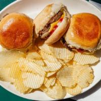 Cheeseburger Sliders · Three mini burgers with American cheese on soft rolls with onions, ketchup and mustard, serv...