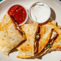 Chicken Quesadilla · Grilled flour tortillas with baked chicken breast tomatoes, scallions and Jack & Cheddar che...