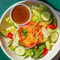 Large Garden Salad · Romaine lettuce, shaved carrots, sliced red onion, red pepper and grape tomatoes.  Served wi...