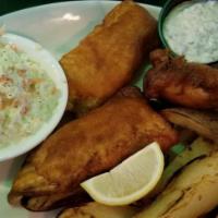 Fish & Chips · Haddock dipped in beer batter and flash fried. Served with breaded potato wedges, coleslaw, ...